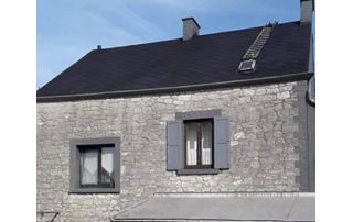 maison en briques grises avec nouvelle toiture